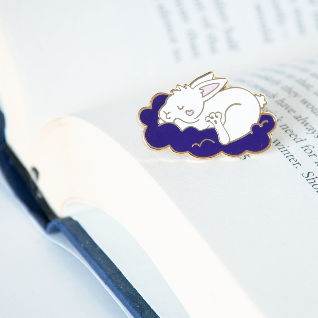 Sleeping white bunny on a cloud with a heart on its cheek enamel pin