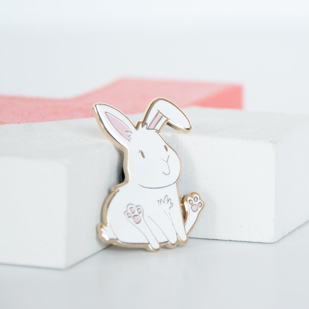 Sitting and smiling white bunny enamel pin