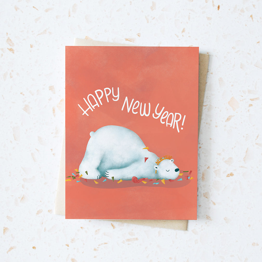 post new year's eve result - sleepy polar bear on the floor with messy party favours everywhere