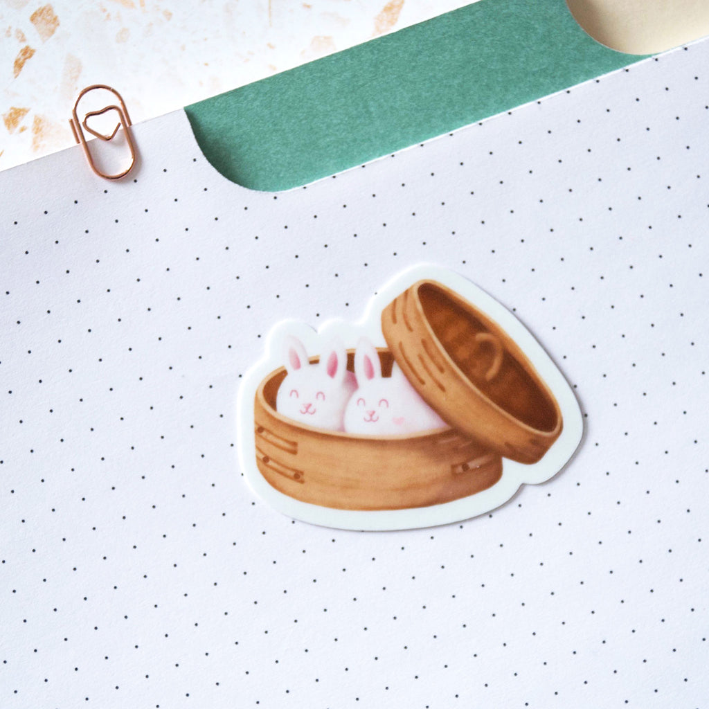 Bunny shaped dumplings in a bamboo dim sum container vinyl sticker