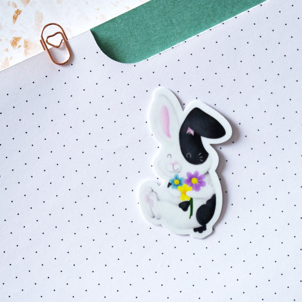 Black and white bunny hugging flowers Vinyl sticker