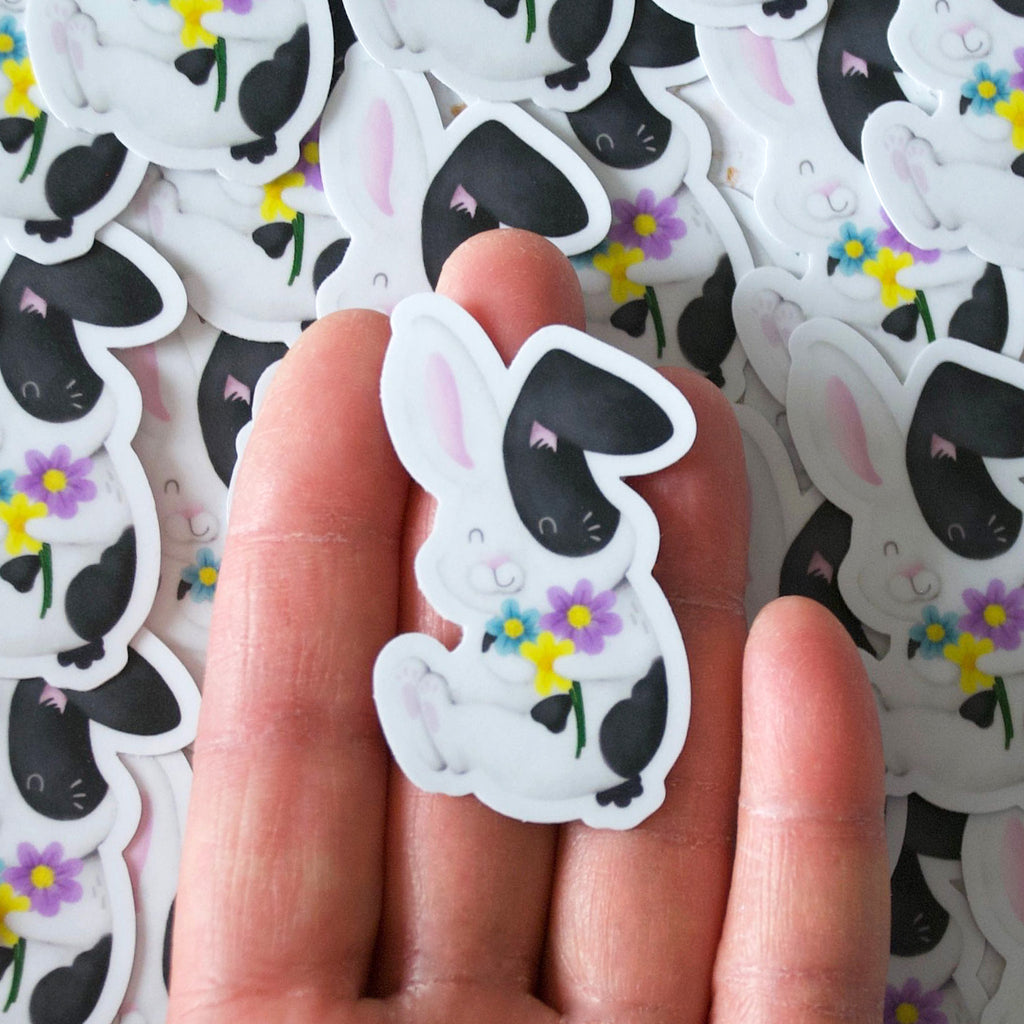 Black and white bunny hugging flowers Vinyl sticker