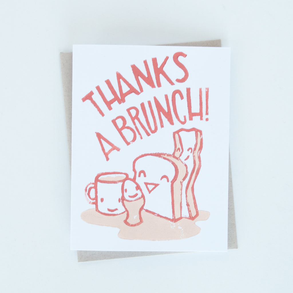 On sale, toast, egg, bacon and cup of coffee illustration block printed in dark and light orange with words "Thanks a brunch!" greeting card