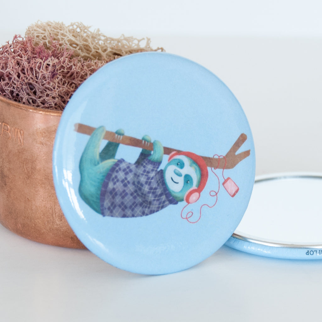 Close up of the hanging sloth travel pocket mirror
